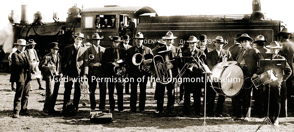 In Marhch of 1907, a group of business boosters from Longmont boarded the train and stopped at Mead. The local band was there to great them and show them around town.